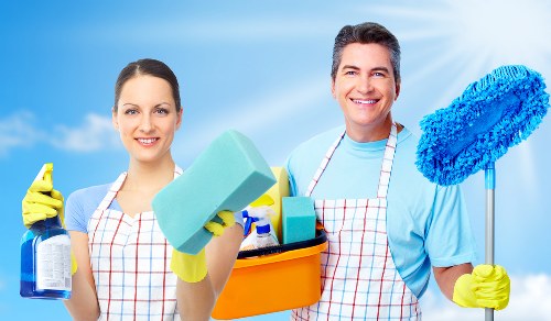 Cleaner maintaining a kitchen during regular cleaning in Camden